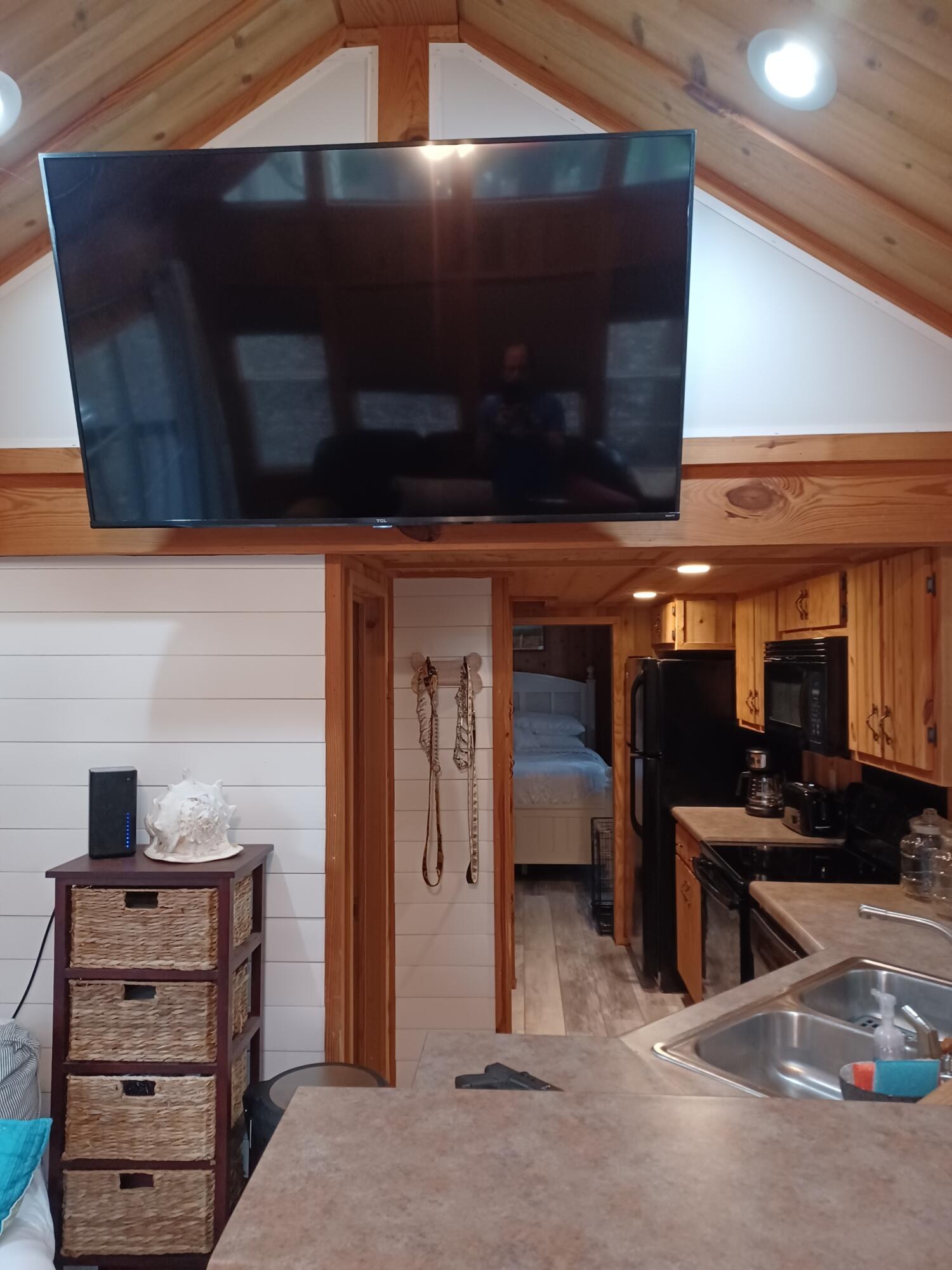 155 Madge Lane Santa Rosa Beach, FL 32459 - Photo 7 of 17 a kitchen with stainless steel appliances kitchen island granite countertop a stove and a microwave