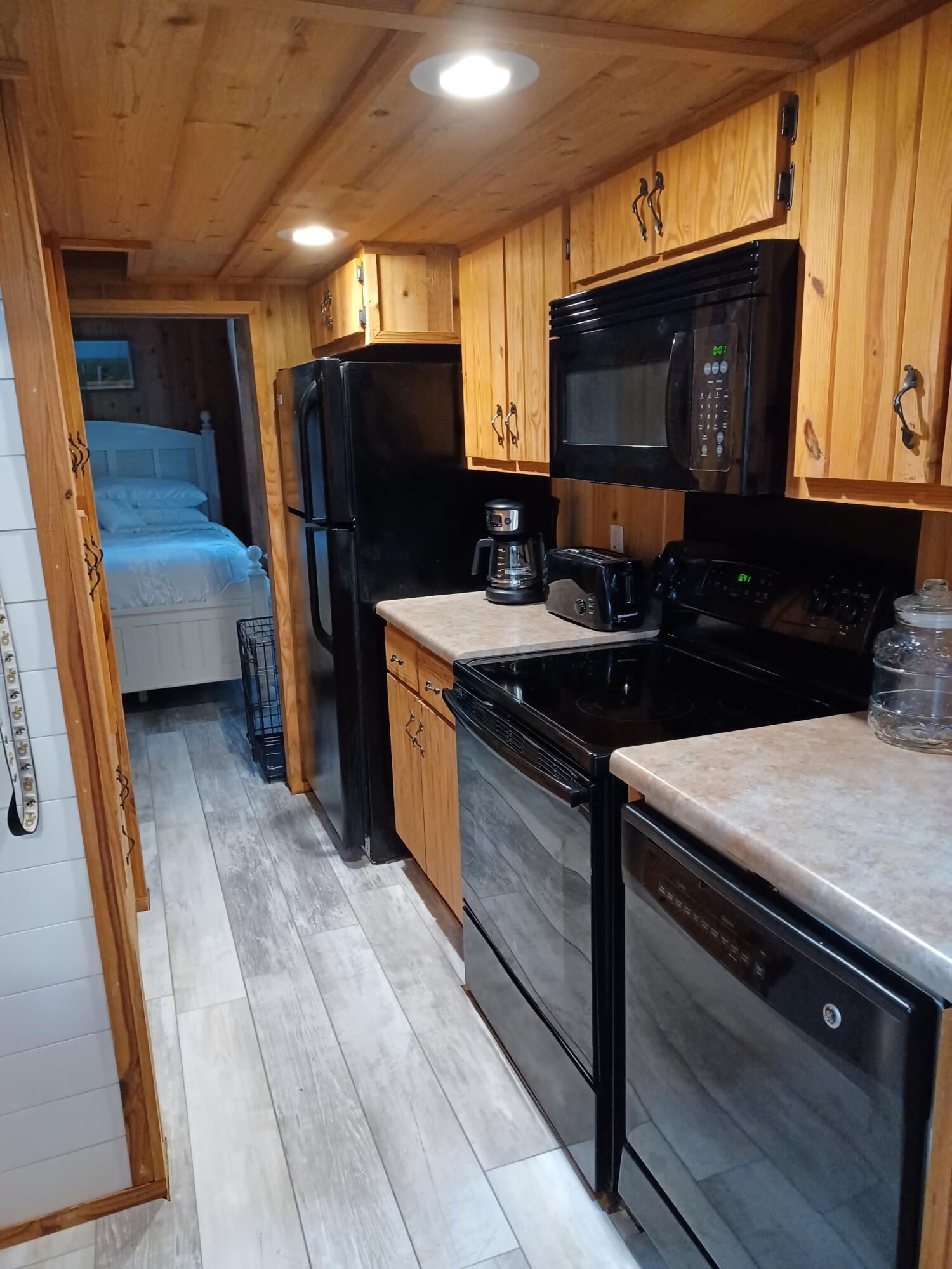 155 Madge Lane Santa Rosa Beach, FL 32459 - Photo 9 of 17 a kitchen with stainless steel appliances granite countertop a sink stove and refrigerator