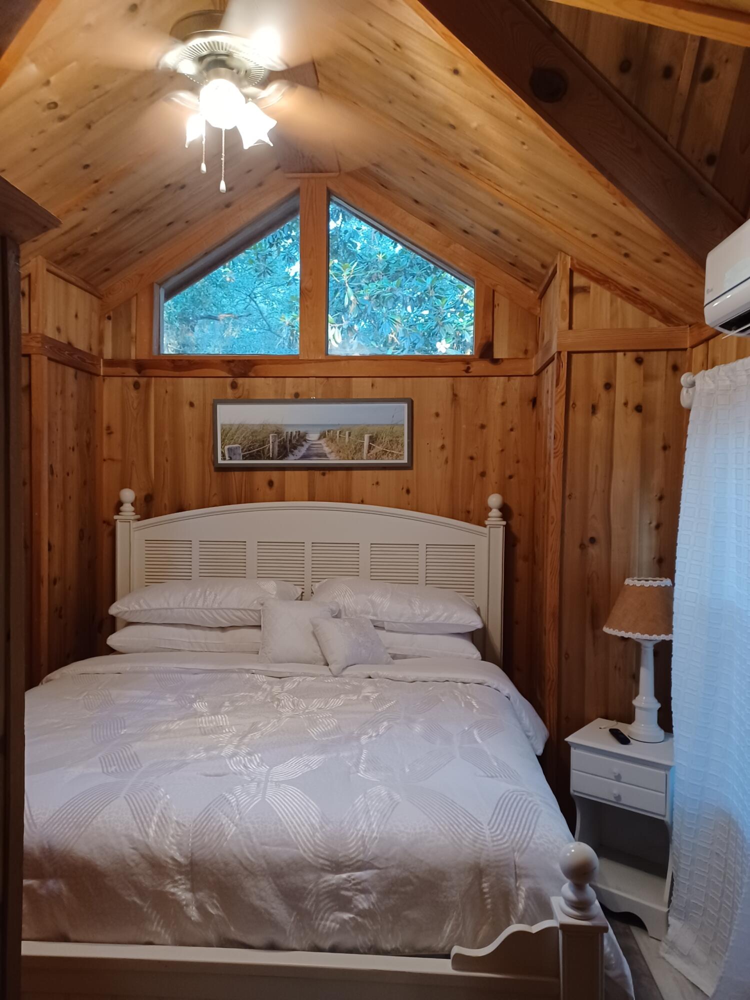 155 Madge Lane Santa Rosa Beach, FL 32459 - Photo 10 of 17 a large bed sitting in a bedroom next to a window