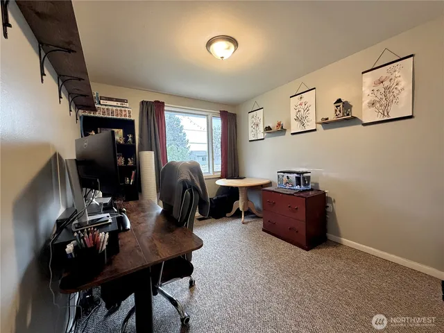 a room with furniture and musical instruments