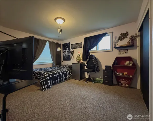 a bedroom with furniture and a window