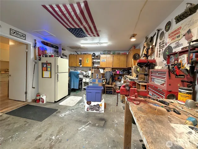 a view of a storage room with racks shoes and chairs
