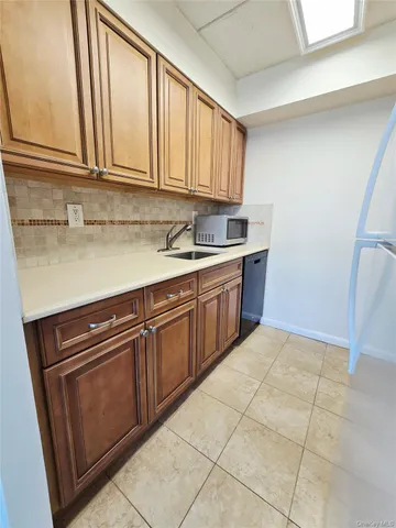 a kitchen with a stove and a microwave