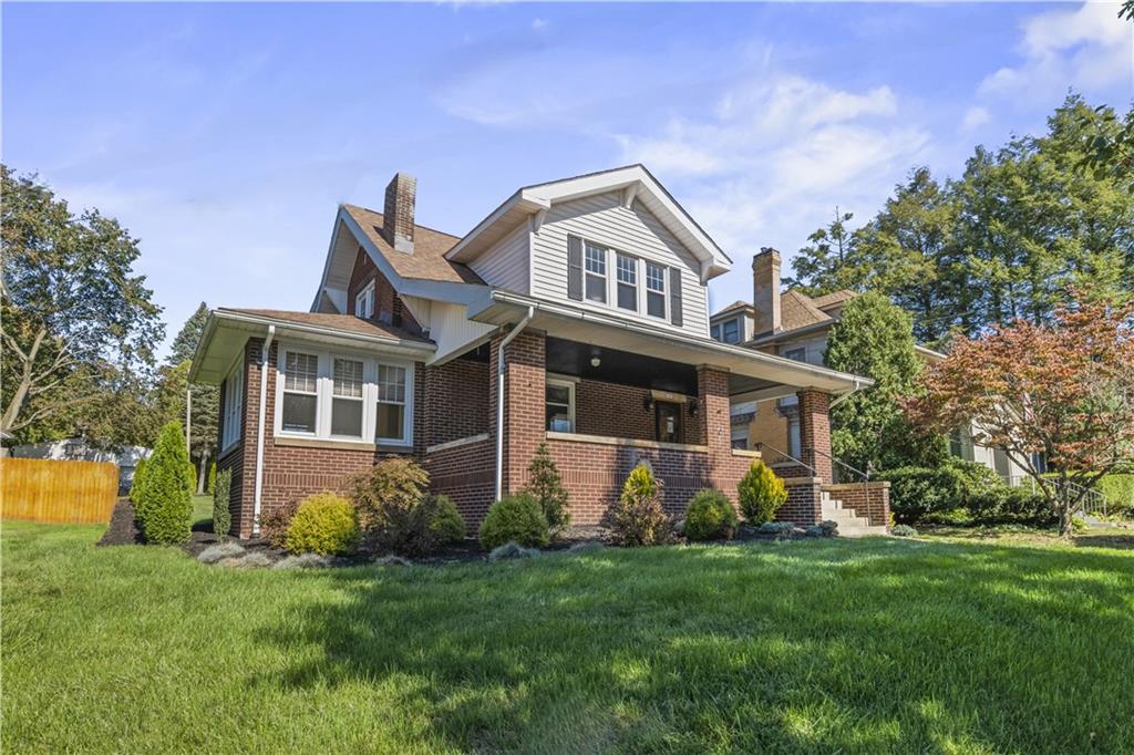 935 Alcoma Street Sharon, PA 16146 - Photo 2 of 28 a front view of house with yard and green space