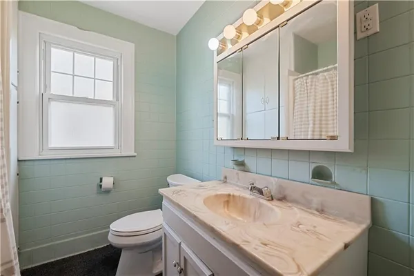 a bathroom with a sink and a toilet