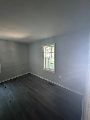 a kitchen with a wooden floor and a counter top space