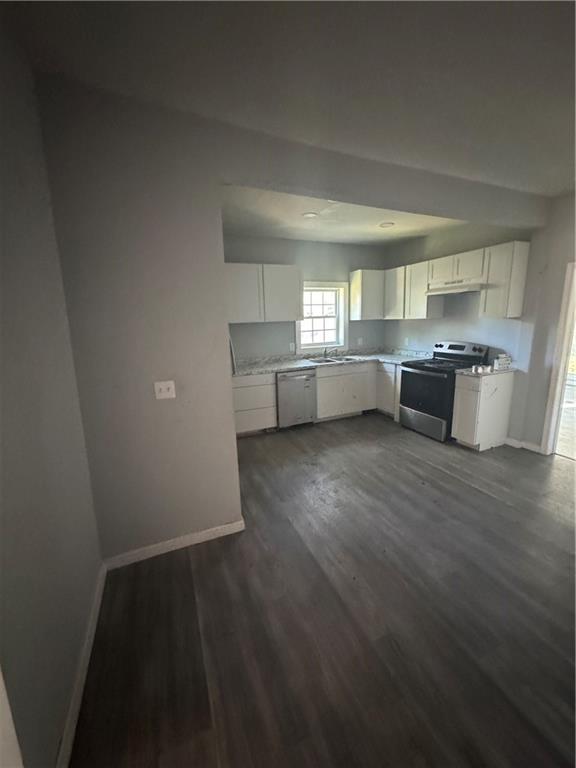 711 Highway 162 Covington, GA 30016 - Photo 13 of 25 a kitchen with a wooden floor and a counter top space