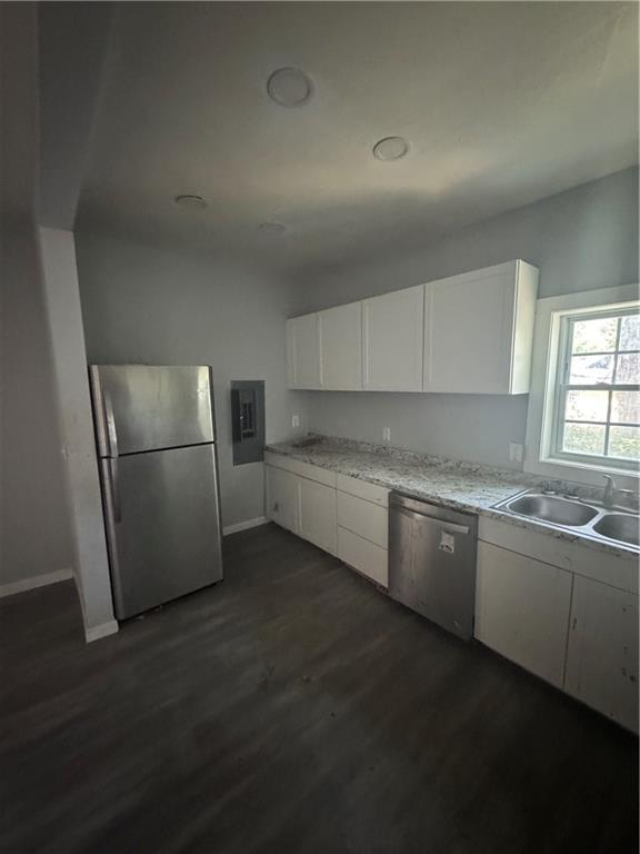 711 Highway 162 Covington, GA 30016 - Photo 14 of 25 a kitchen with granite countertop a refrigerator and a sink