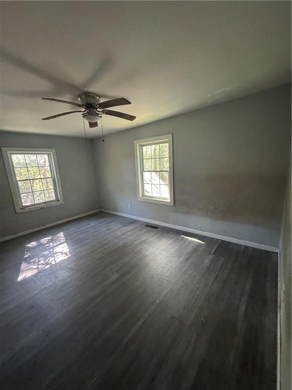 711 Highway 162 Covington, GA 30016 - Photo 20 of 25 en empty room with windows and ceiling fan view