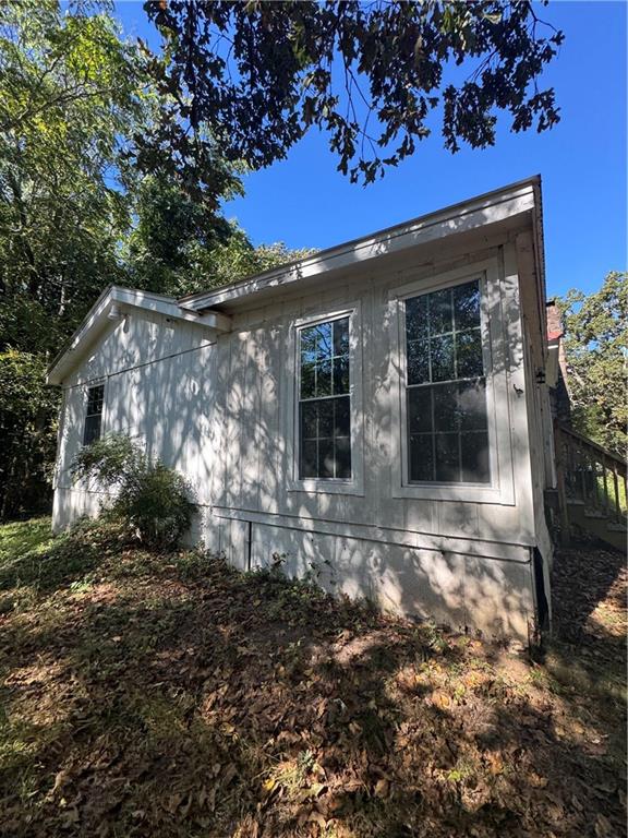 711 Highway 162 Covington, GA 30016 - Photo 4 of 25 a view of a house with a small yard and floor to ceiling window