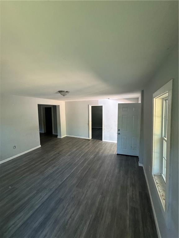 711 Highway 162 Covington, GA 30016 - Photo 10 of 25 wooden floor in an empty room and a window