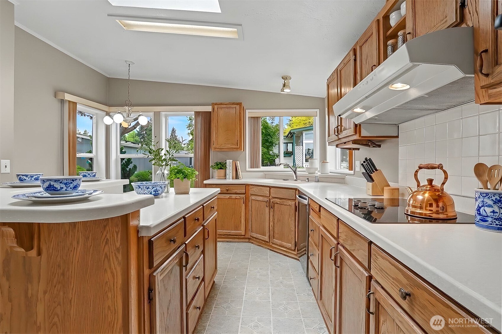 905 243rd Street Southwest Bothell, WA 98021 - Photo 2 of 37 a kitchen with stainless steel appliances granite countertop a sink and a stove