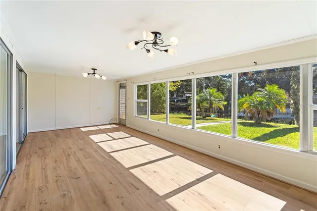 a view of an empty room with a large window