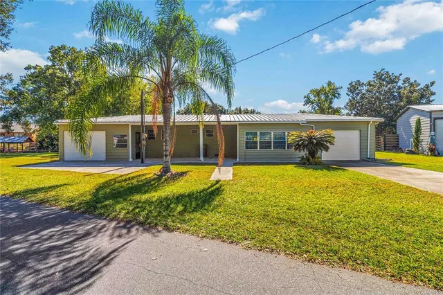 front view of a house with a swimming pool
