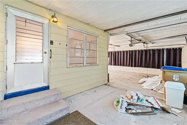 a view of a room with furniture and wooden floor
