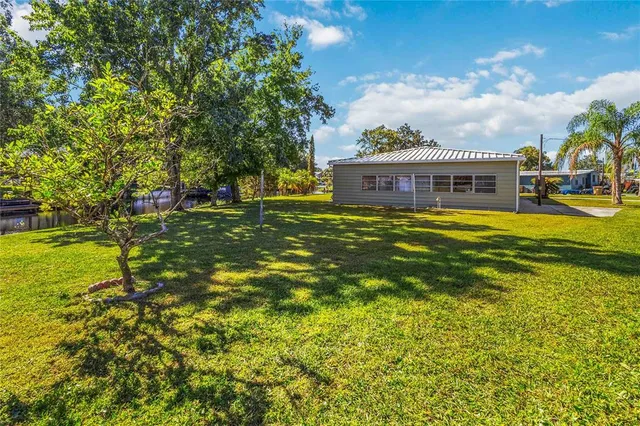 a view of a house with a big yard