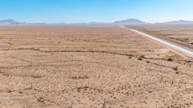 a view of an ocean with a mountain