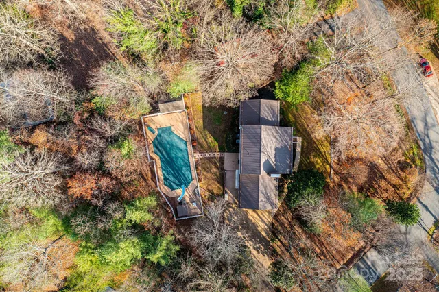a aerial view of a house with swimming pool and sitting area