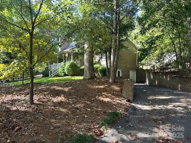 a backyard of a house with lots of green space