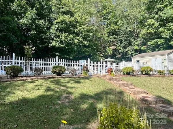 a view of backyard with green space