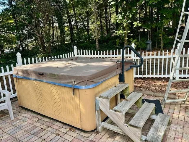 a view of outdoor space and deck having patio