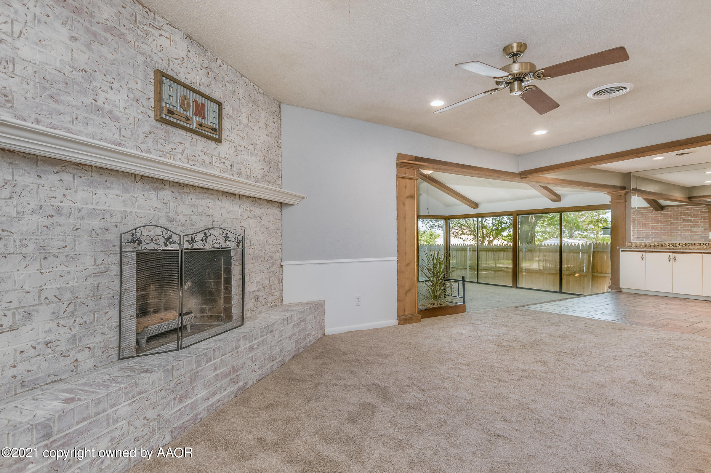 4222 Gary Lane Amarillo, TX 79110 - Photo 2 of 20 a view of an empty room with a fireplace and a window