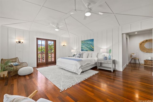 a bathroom with a granite countertop sink a mirror and shower