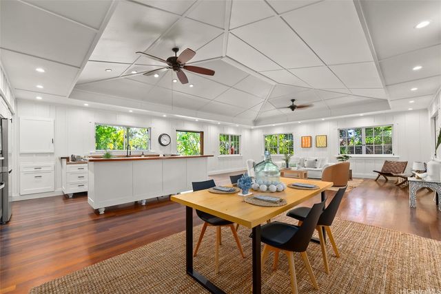a large kitchen with stainless steel appliances granite countertop a lot of counter space and a sink