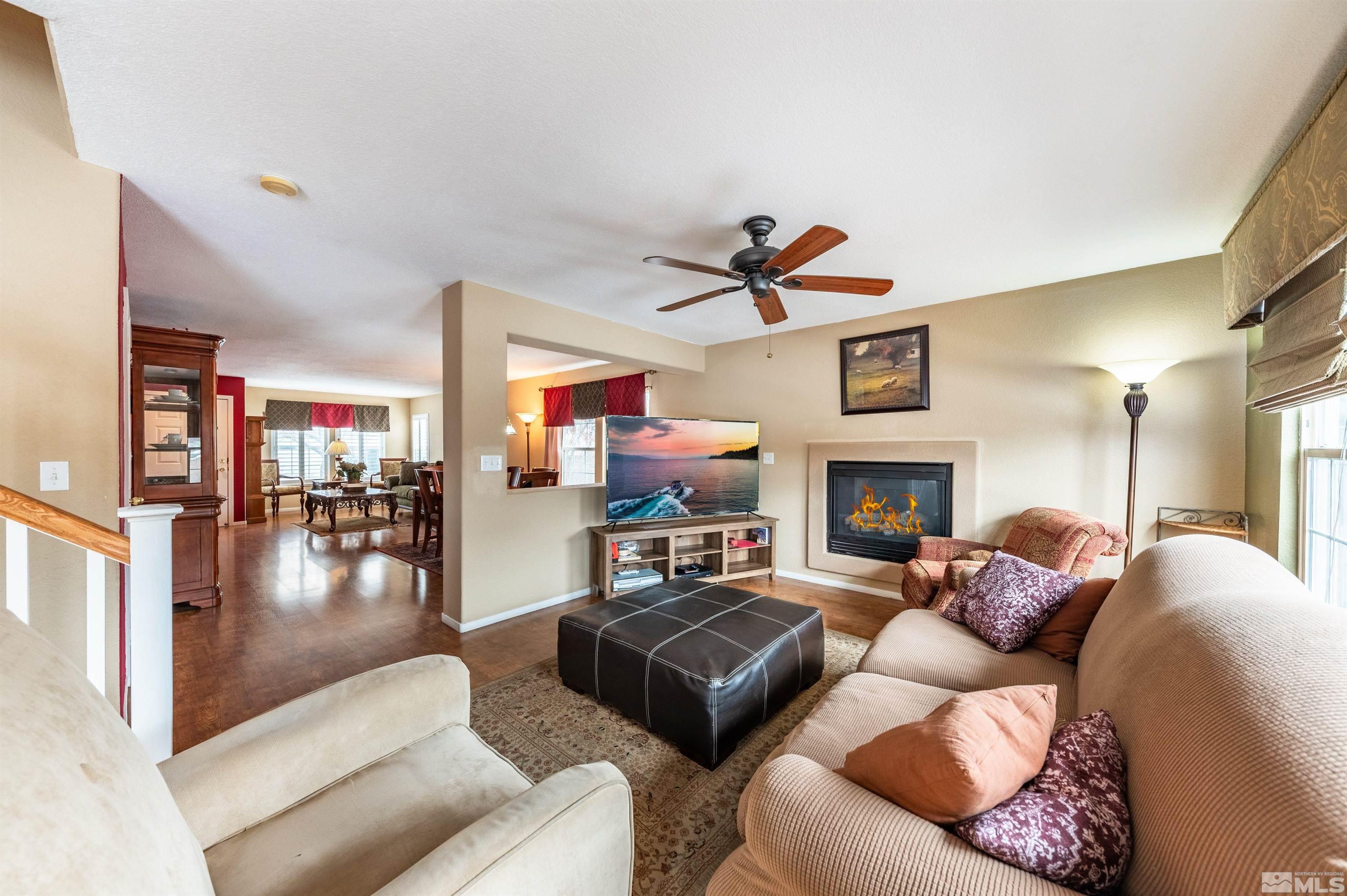 7830 Welsh Drive Reno, NV 89506 - Photo 11 of 27 a living room with furniture and a fireplace