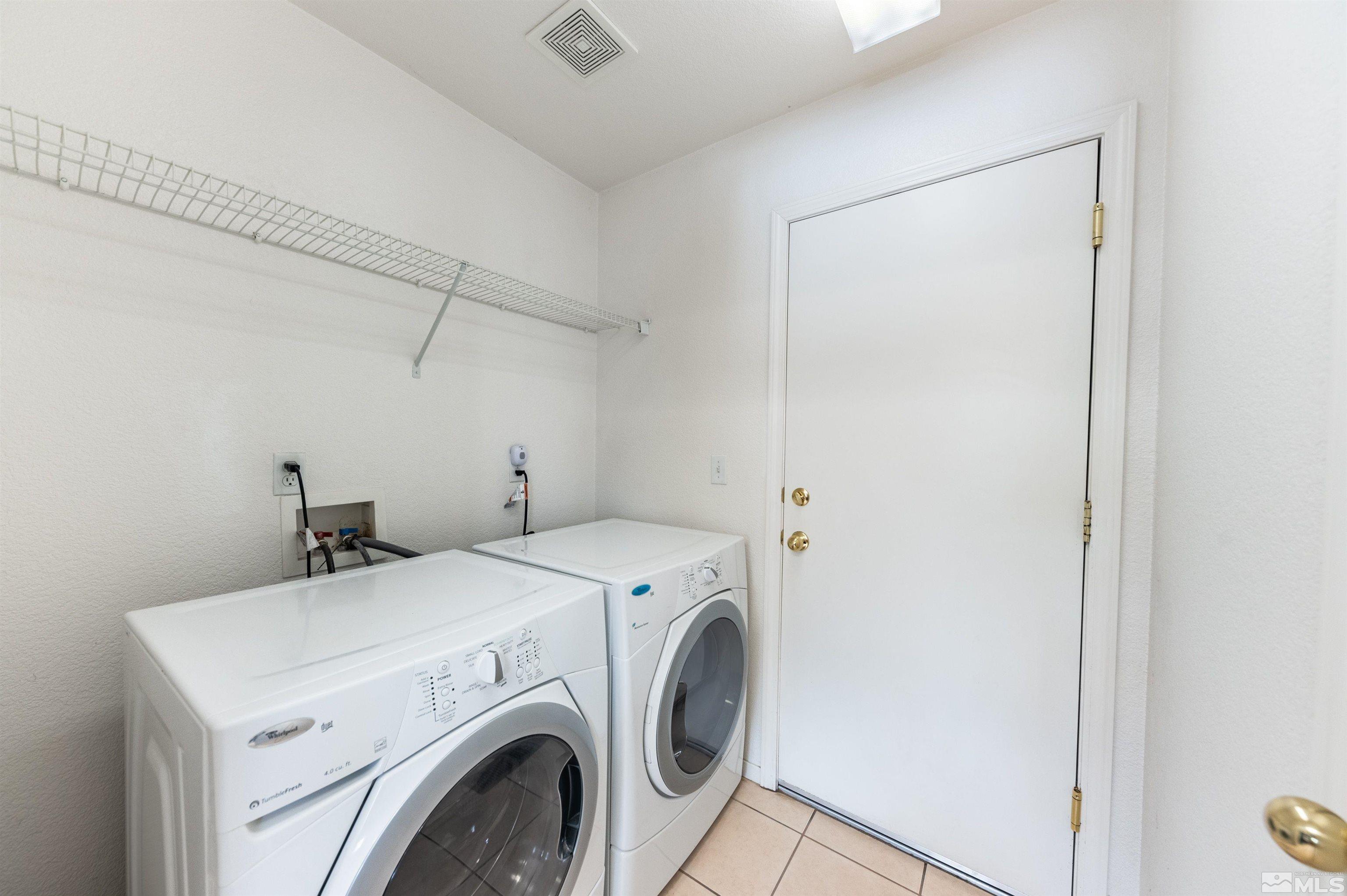 7830 Welsh Drive Reno, NV 89506 - Photo 17 of 27 a utility room with dryer and washer