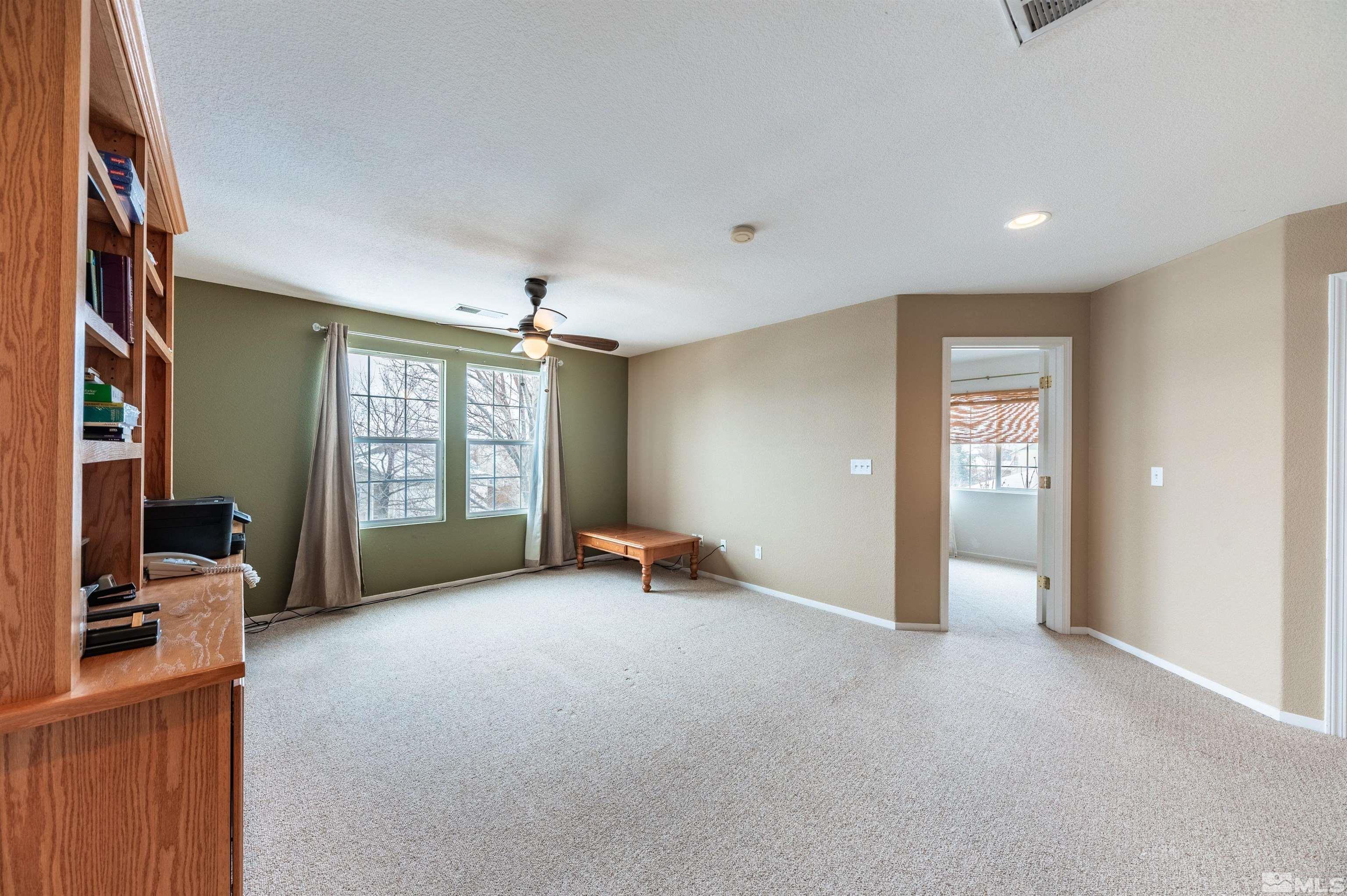 7830 Welsh Drive Reno, NV 89506 - Photo 19 of 27 a view of a livingroom with furniture and a window