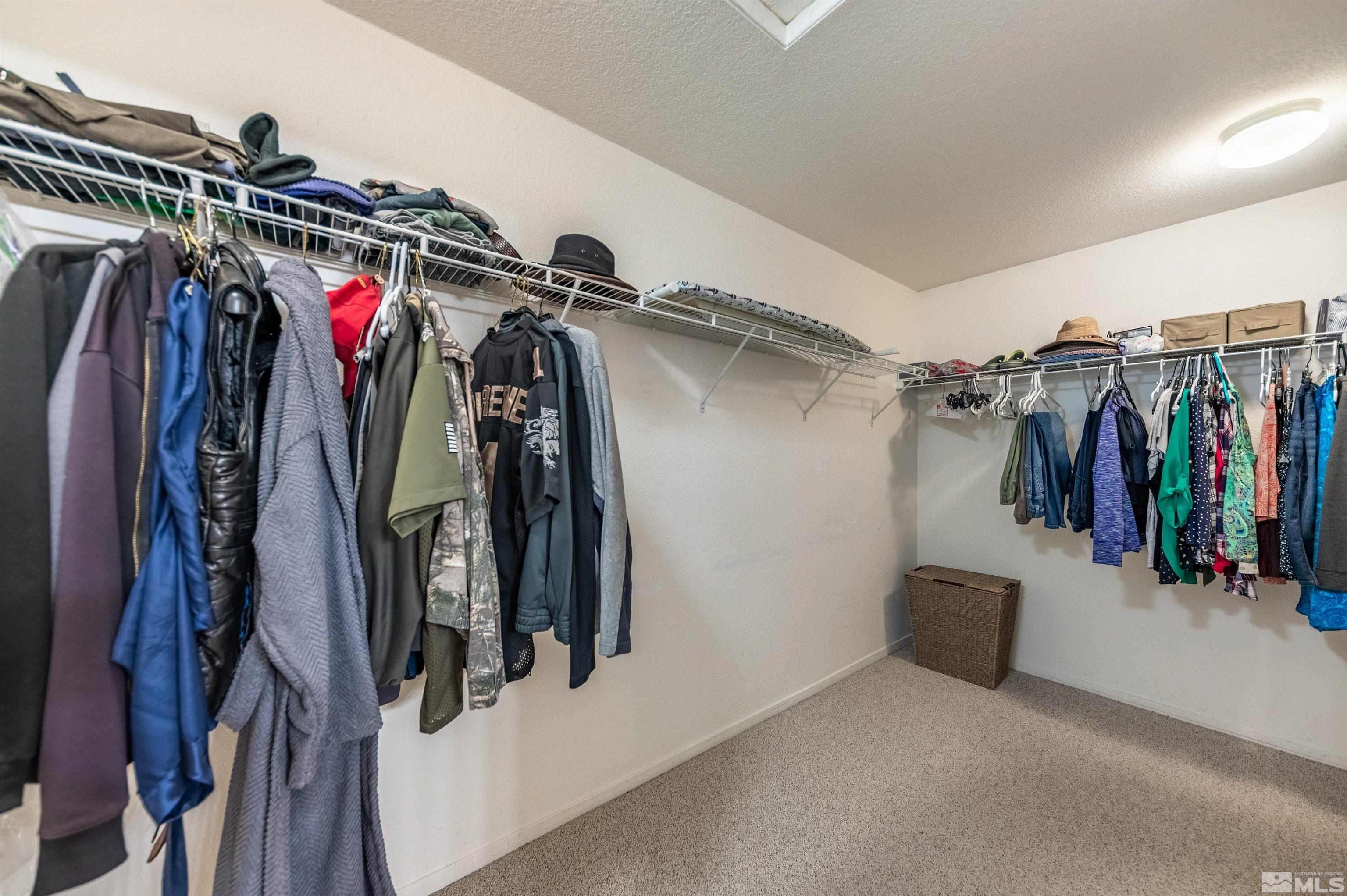 7830 Welsh Drive Reno, NV 89506 - Photo 22 of 27 a view of walk in closet with clothes