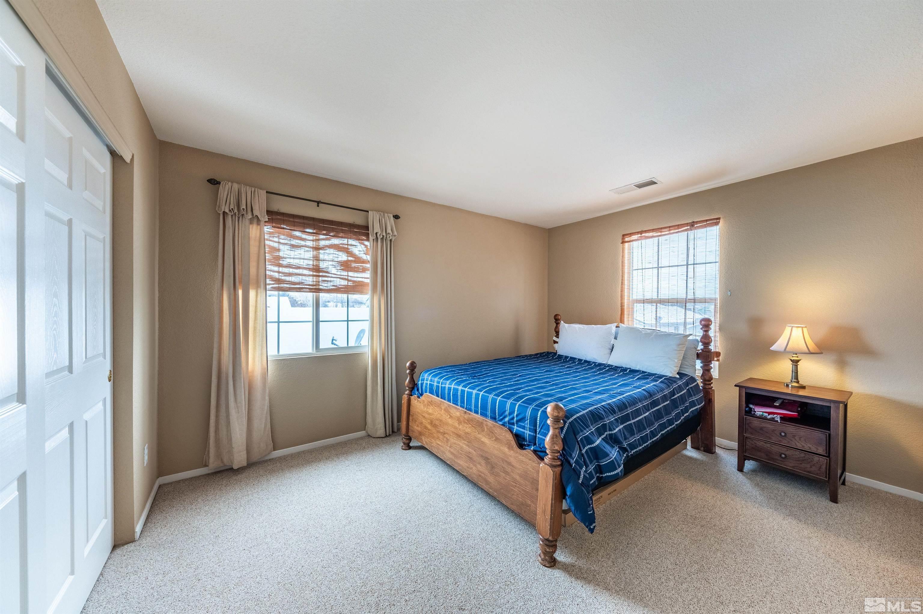 7830 Welsh Drive Reno, NV 89506 - Photo 23 of 27 a bedroom with a bed and window