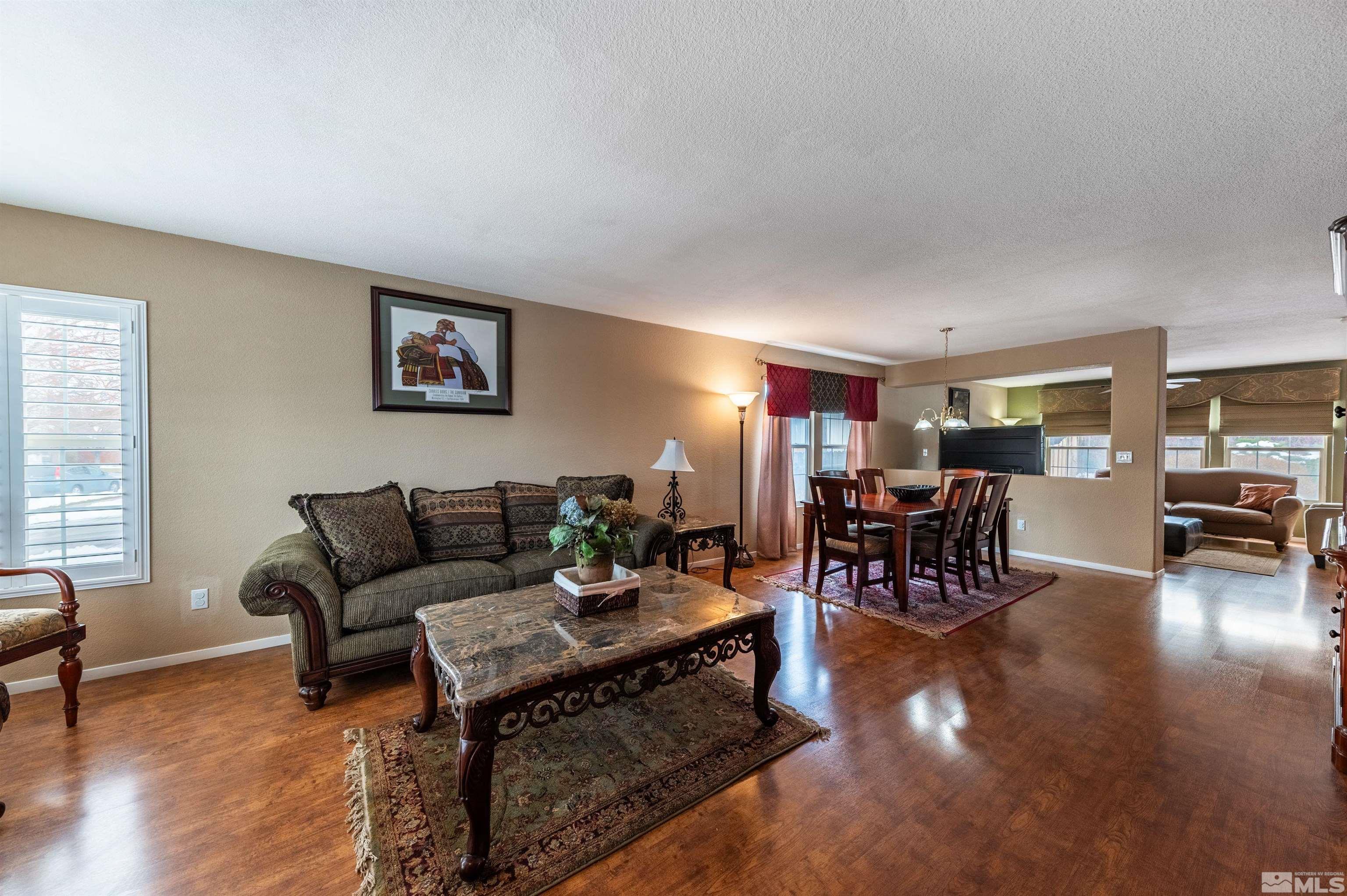 7830 Welsh Drive Reno, NV 89506 - Photo 4 of 27 a living room with furniture and wooden floor