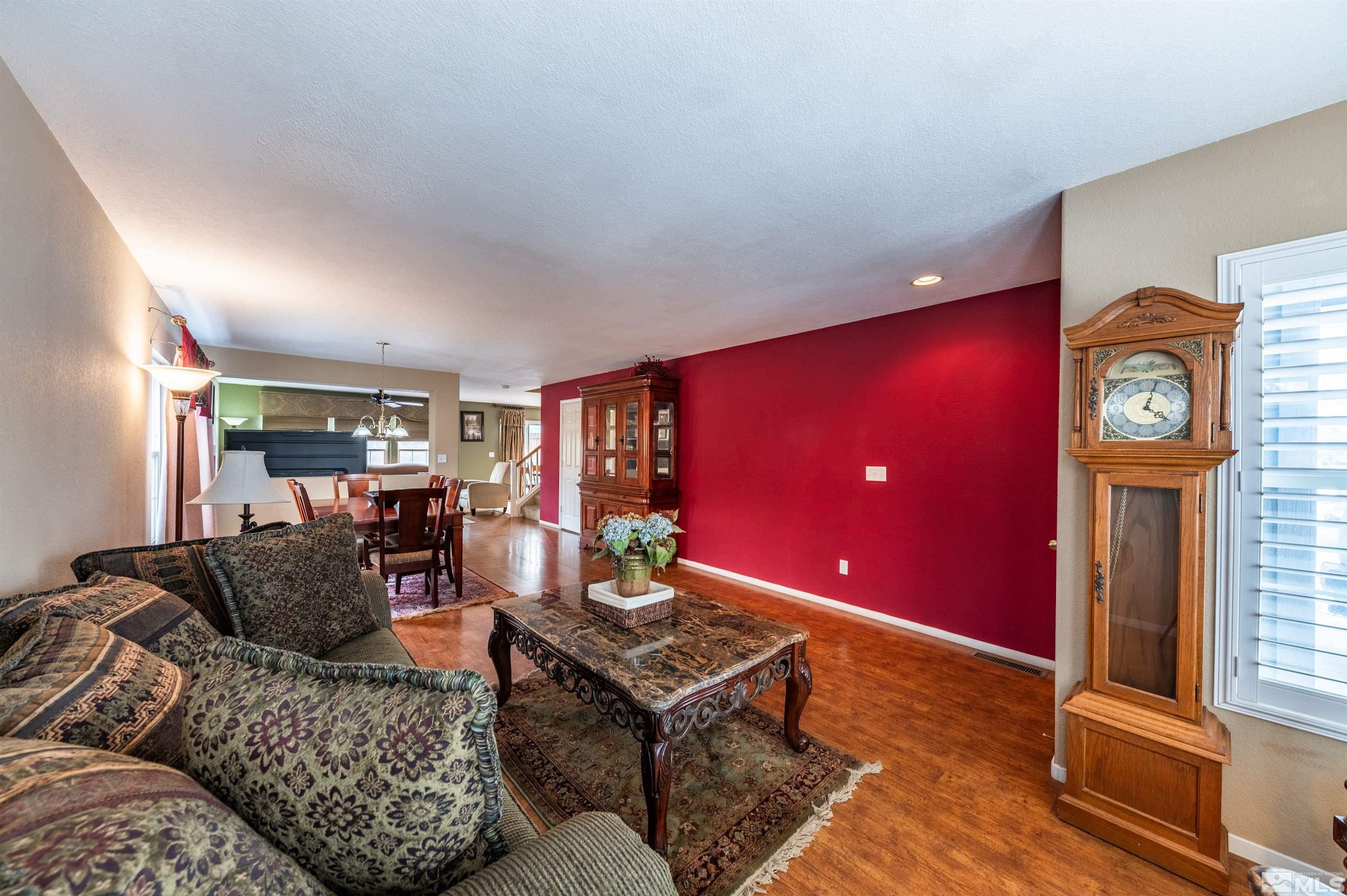 7830 Welsh Drive Reno, NV 89506 - Photo 6 of 27 a living room with furniture and a clock