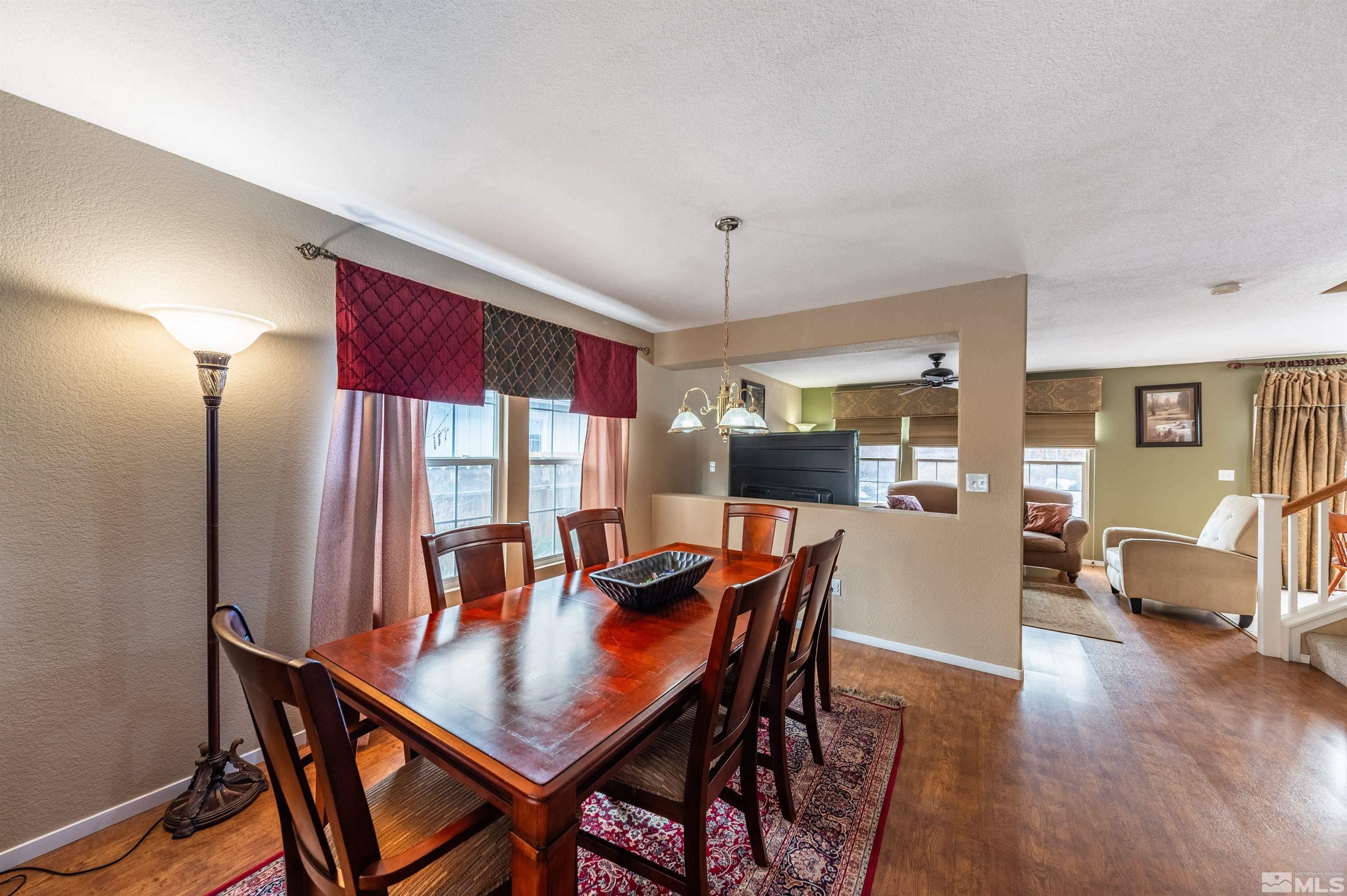 7830 Welsh Drive Reno, NV 89506 - Photo 7 of 27 a view of a dining room with furniture and wooden floor