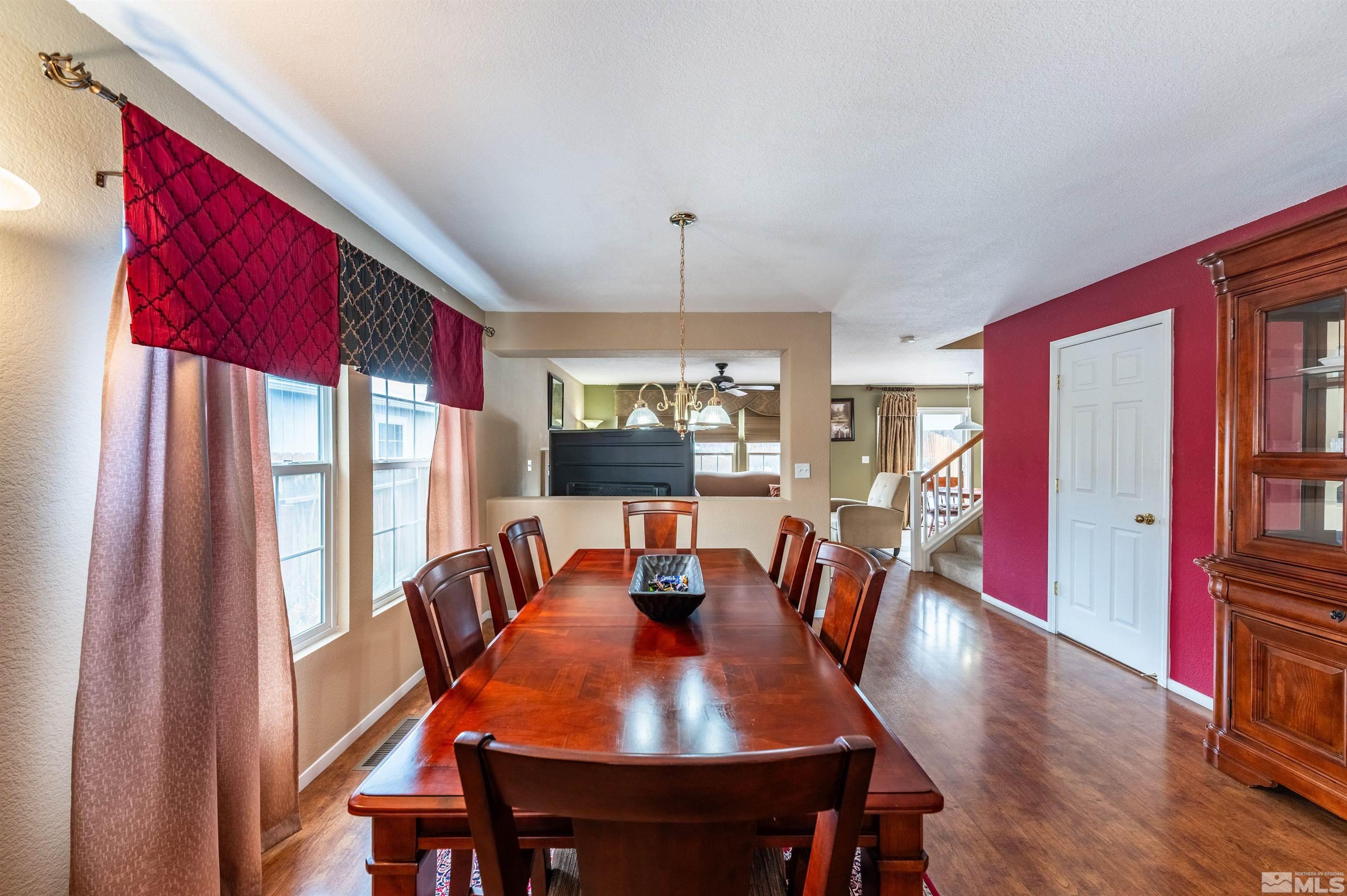 7830 Welsh Drive Reno, NV 89506 - Photo 9 of 27 a view of a dining room with furniture window and wooden floor