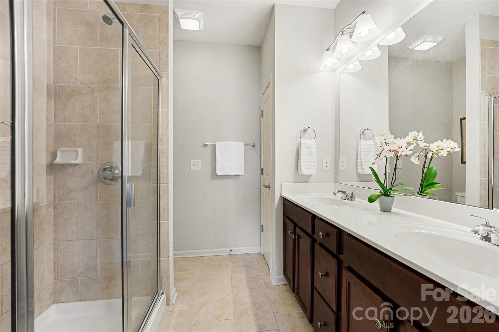 1225 Assembly Street Belmont, NC 28012 - Photo 13 of 17 a bathroom with a double vanity sink and a mirror