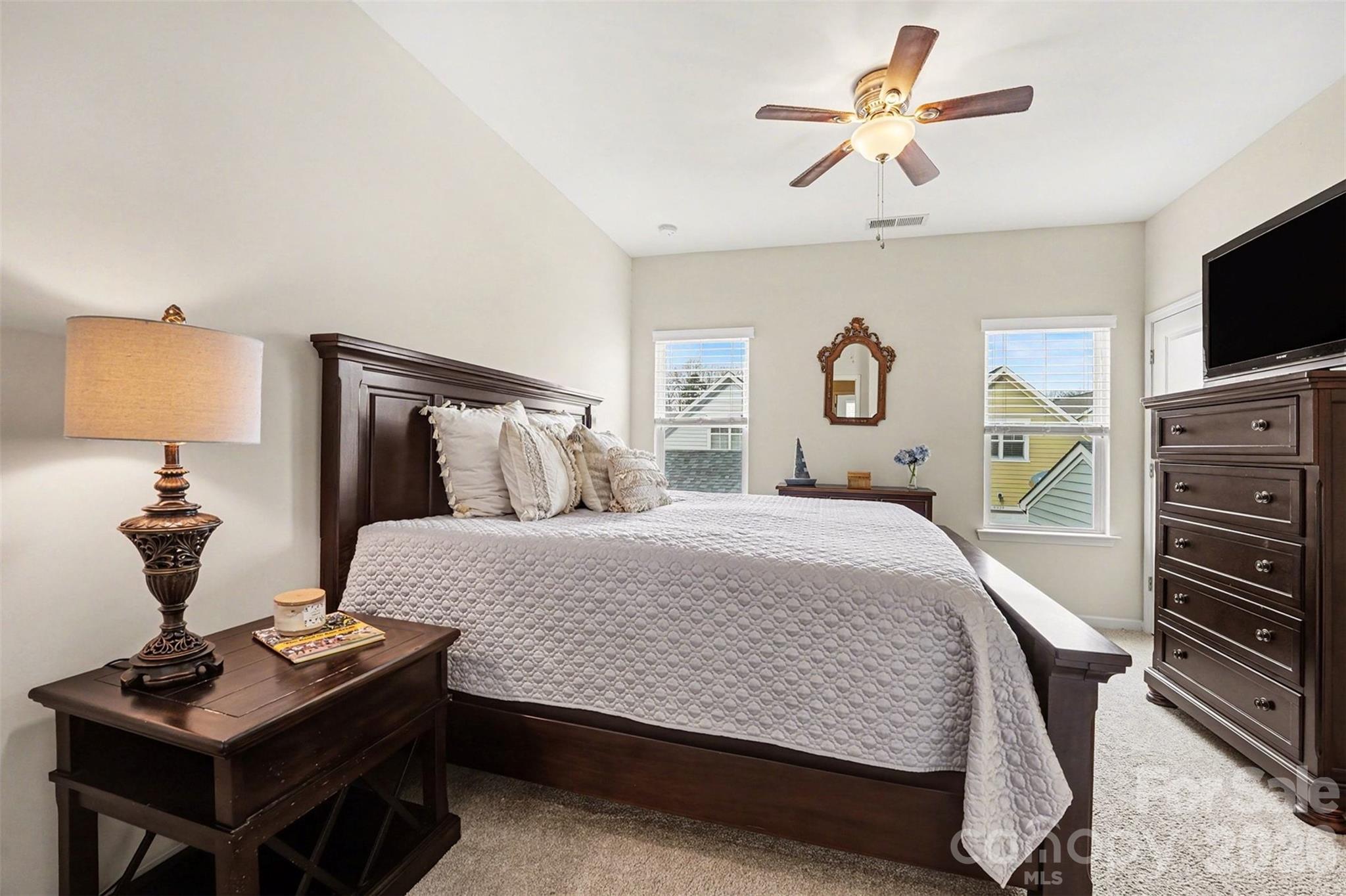 1225 Assembly Street Belmont, NC 28012 - Photo 14 of 17 a bedroom with a bed and a flat screen tv