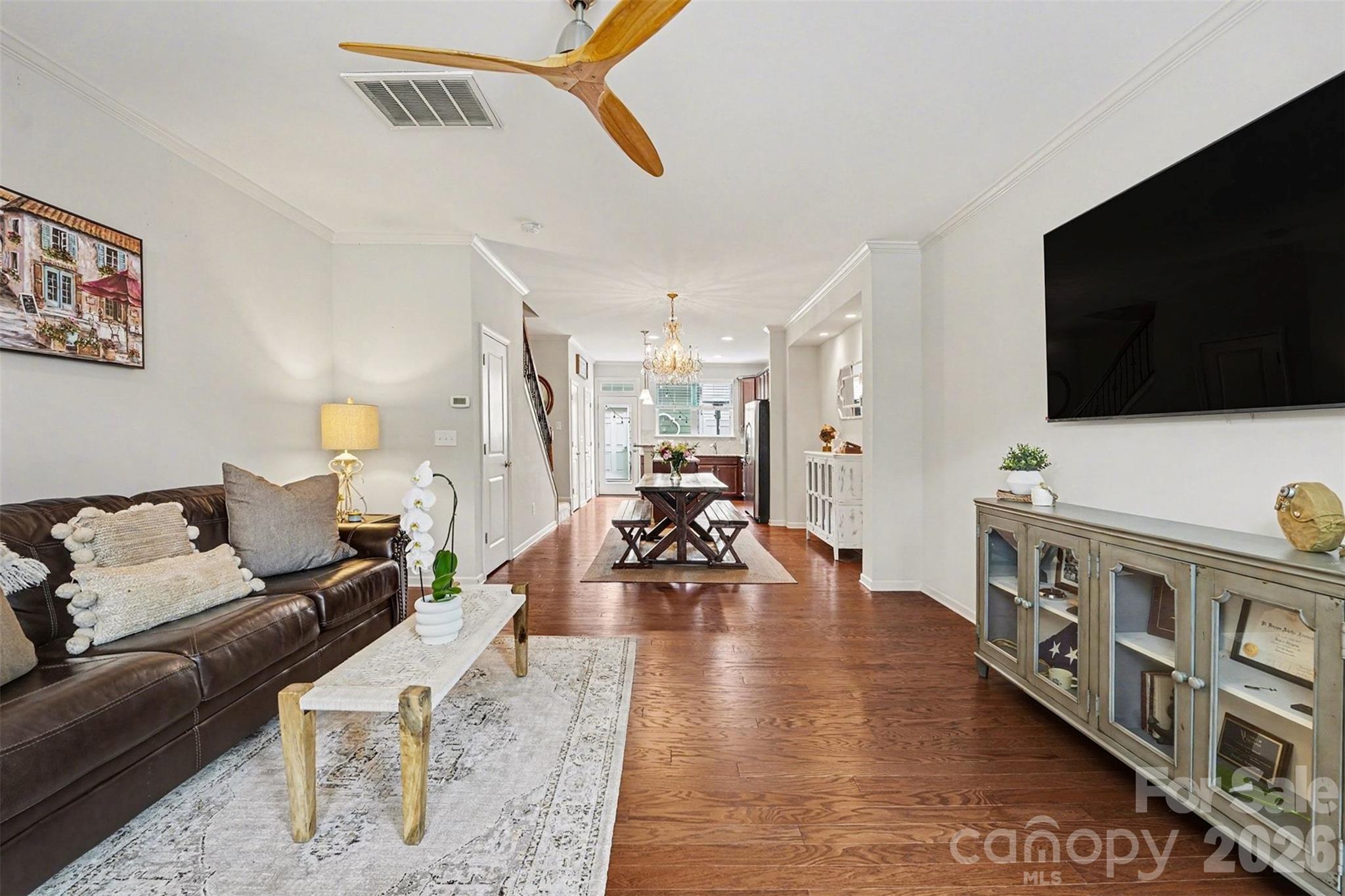 1225 Assembly Street Belmont, NC 28012 - Photo 4 of 17 a living room with furniture and a flat screen tv