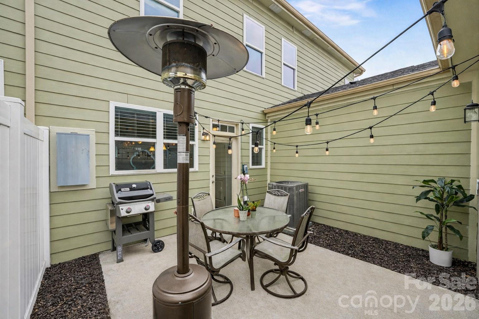 1225 Assembly Street Belmont, NC 28012 - Photo 8 of 17 a view of a patio with couple of chairs and a potted plant