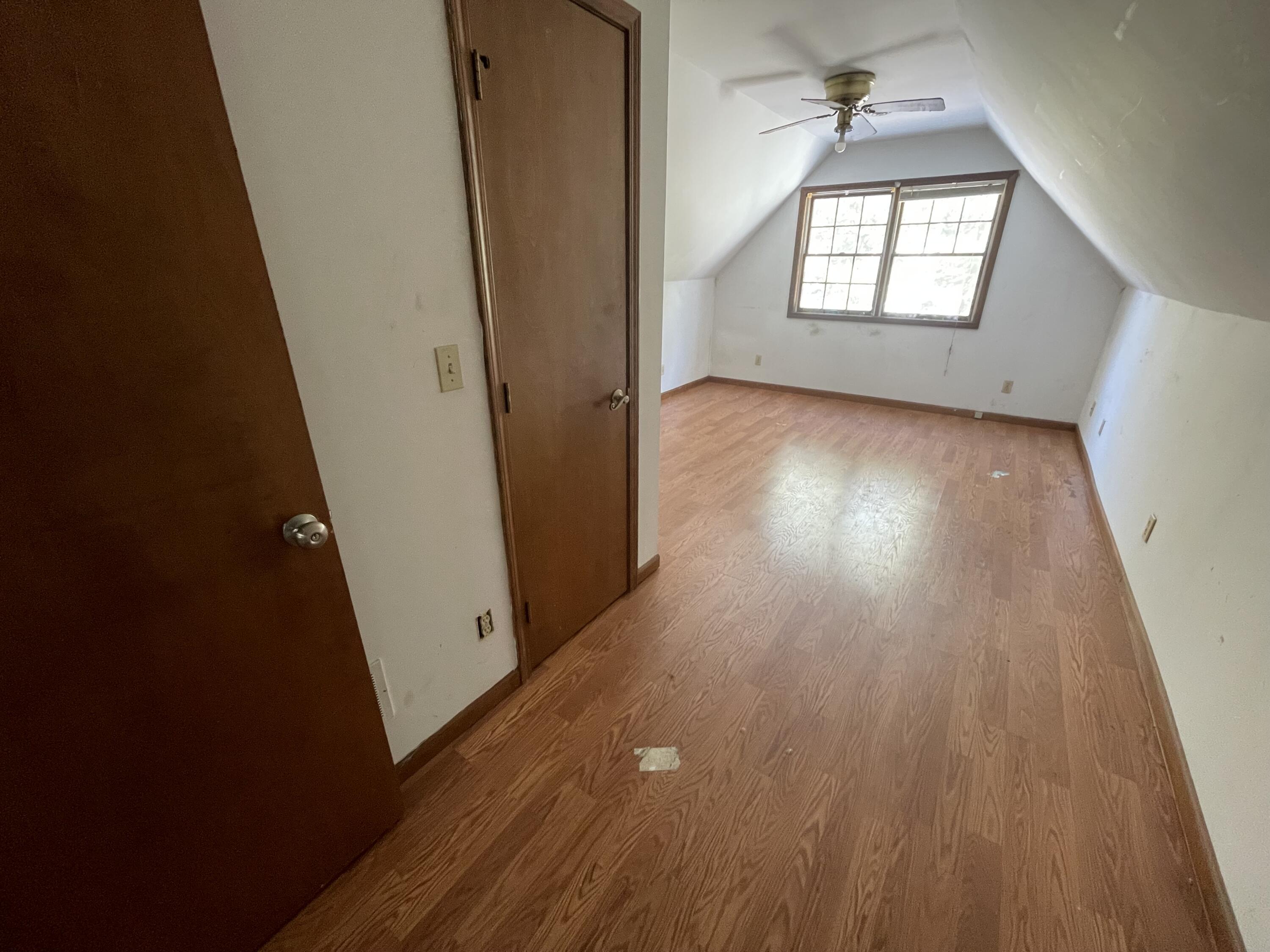 9710 Rustic Drive Demotte, IN 46310 - Photo 15 of 31 wooden floor in an empty room with a window