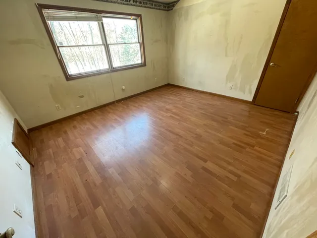 a spacious bathroom with a vanity sink and a mirror
