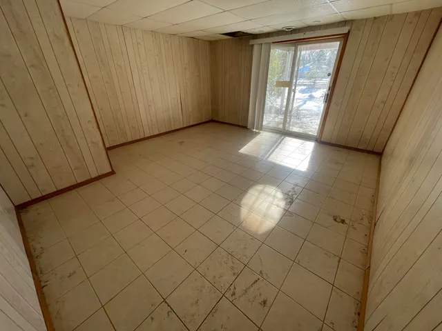 a view of an empty room and window