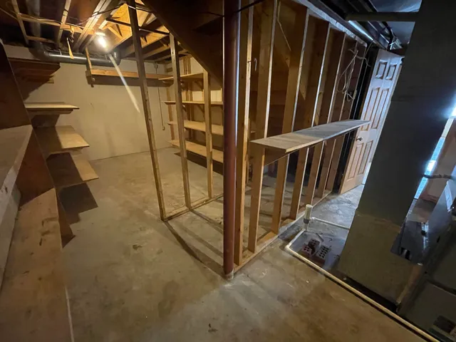 a view of storage and utility room with racks on the wall