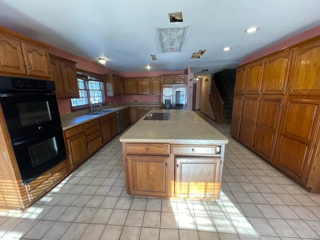 a living room with a couch and a large window