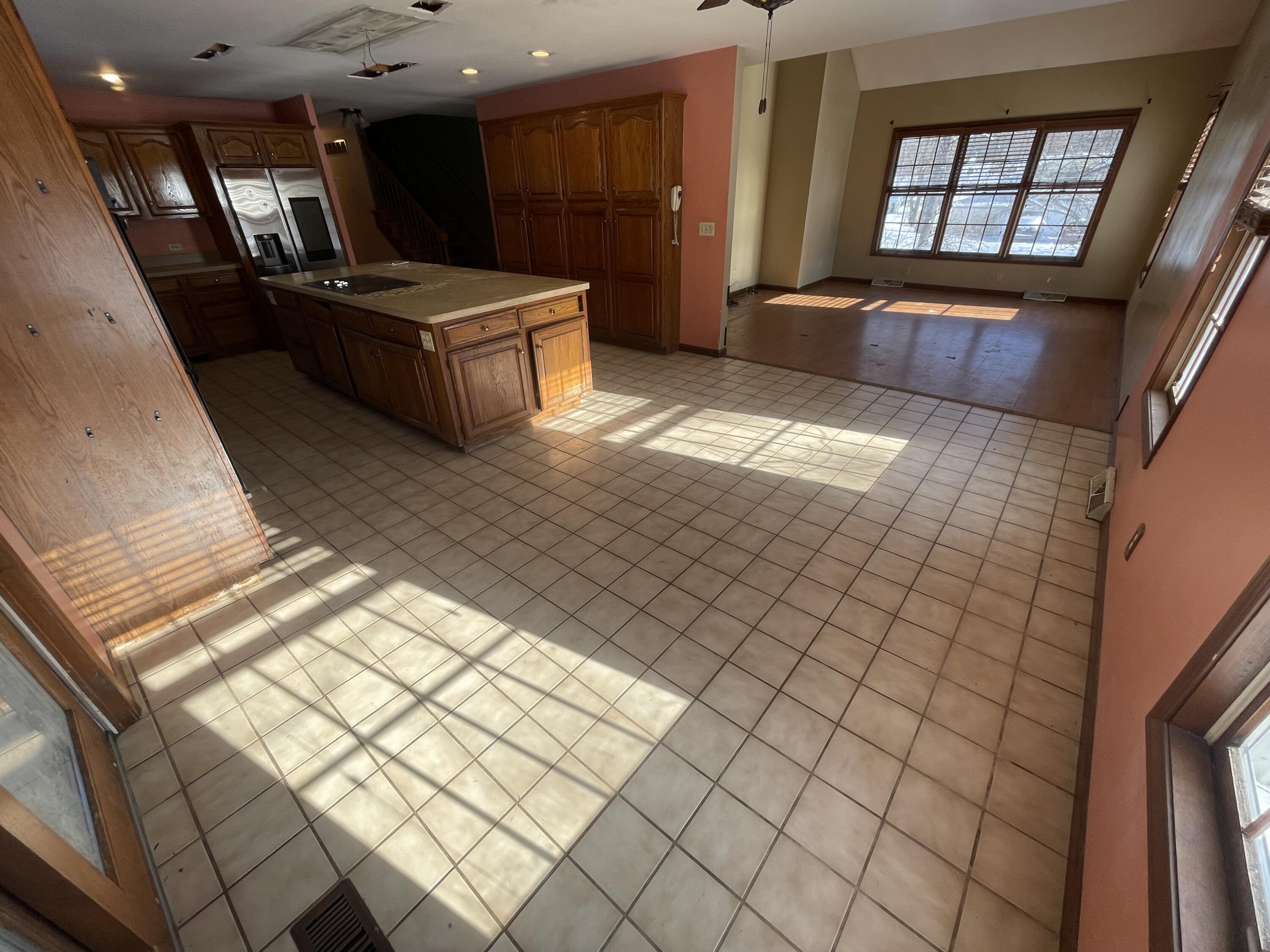 9710 Rustic Drive Demotte, IN 46310 - Photo 8 of 31 a living room with a couch and a large window