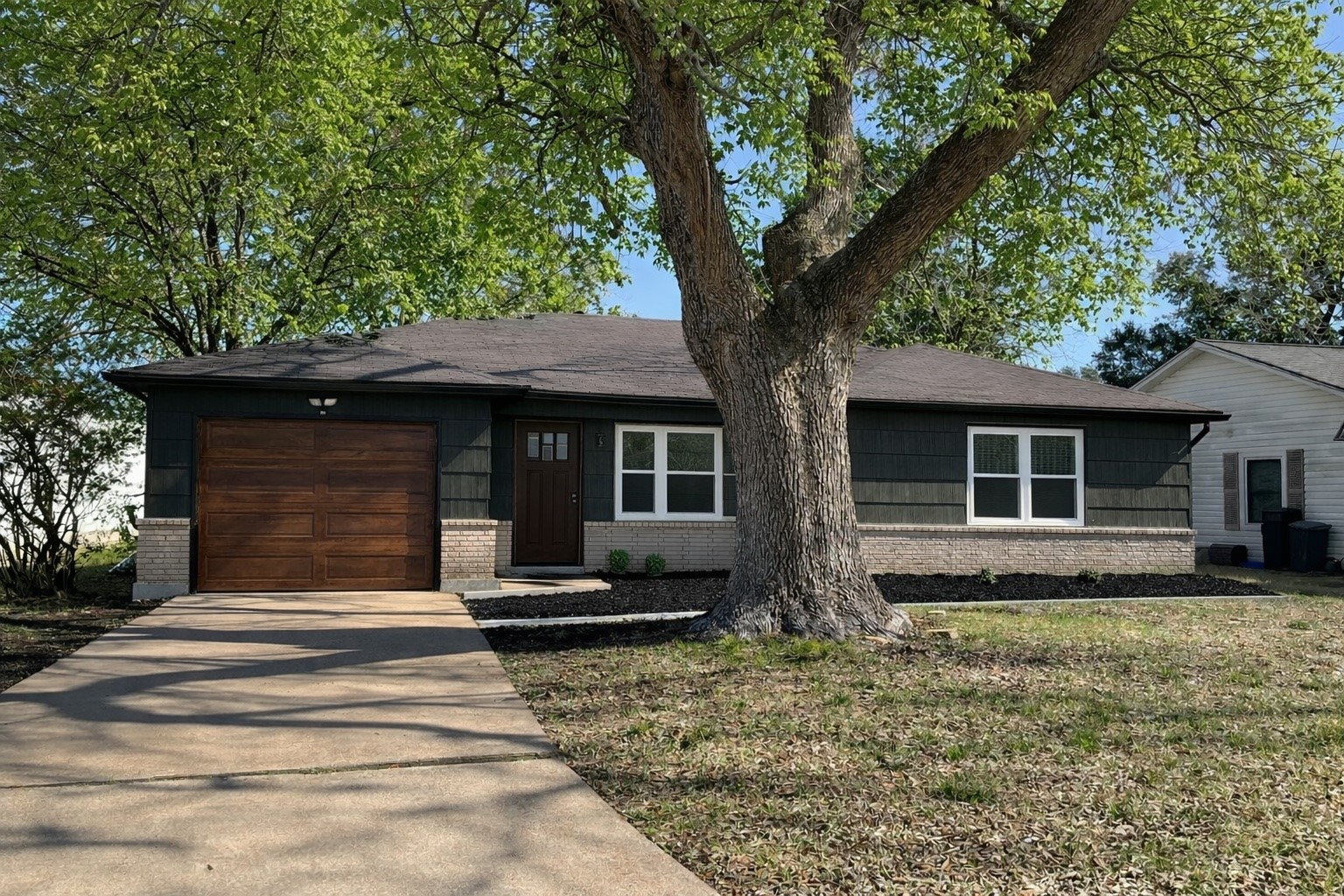 1119 Tobola Street Rosenberg, TX 77471 - Photo 1 of 14 The garage, front door, and flower bed have been altered with AI
