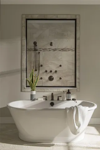 a white bath tub sitting in a bathroom