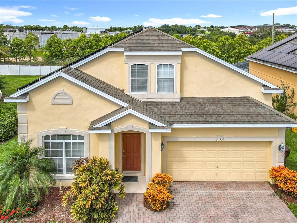 334 Cadiz Loop Davenport, FL 33837 - Photo 1 of 63 a view of a house with a yard